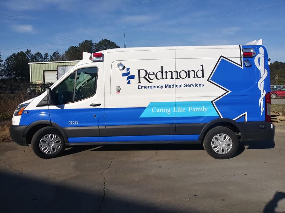Redmond Emergency Medical Services transit van with blue and white graphics