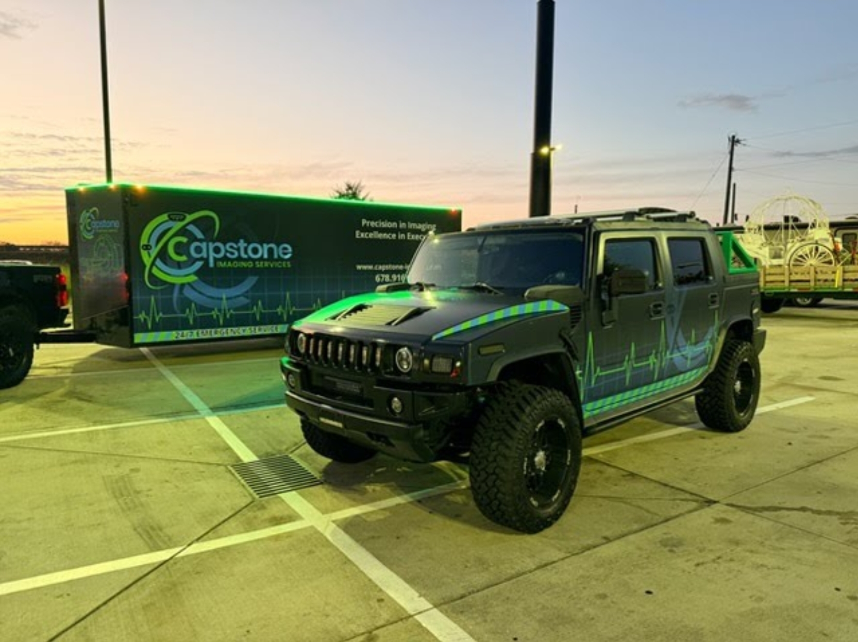 Capstone Imaging Hummer H2 and matching trailer wrapped in full printed graphics with reflective heartbeat line accents