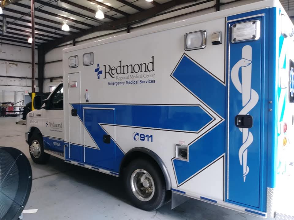 Redmond Regional Medical Center ambulance box with blue and white cut vinyl graphics