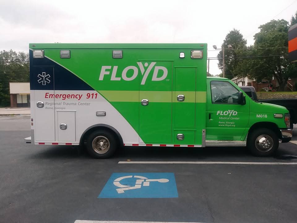 Green Floyd Medical Center ambulance with white and navy emergency graphics